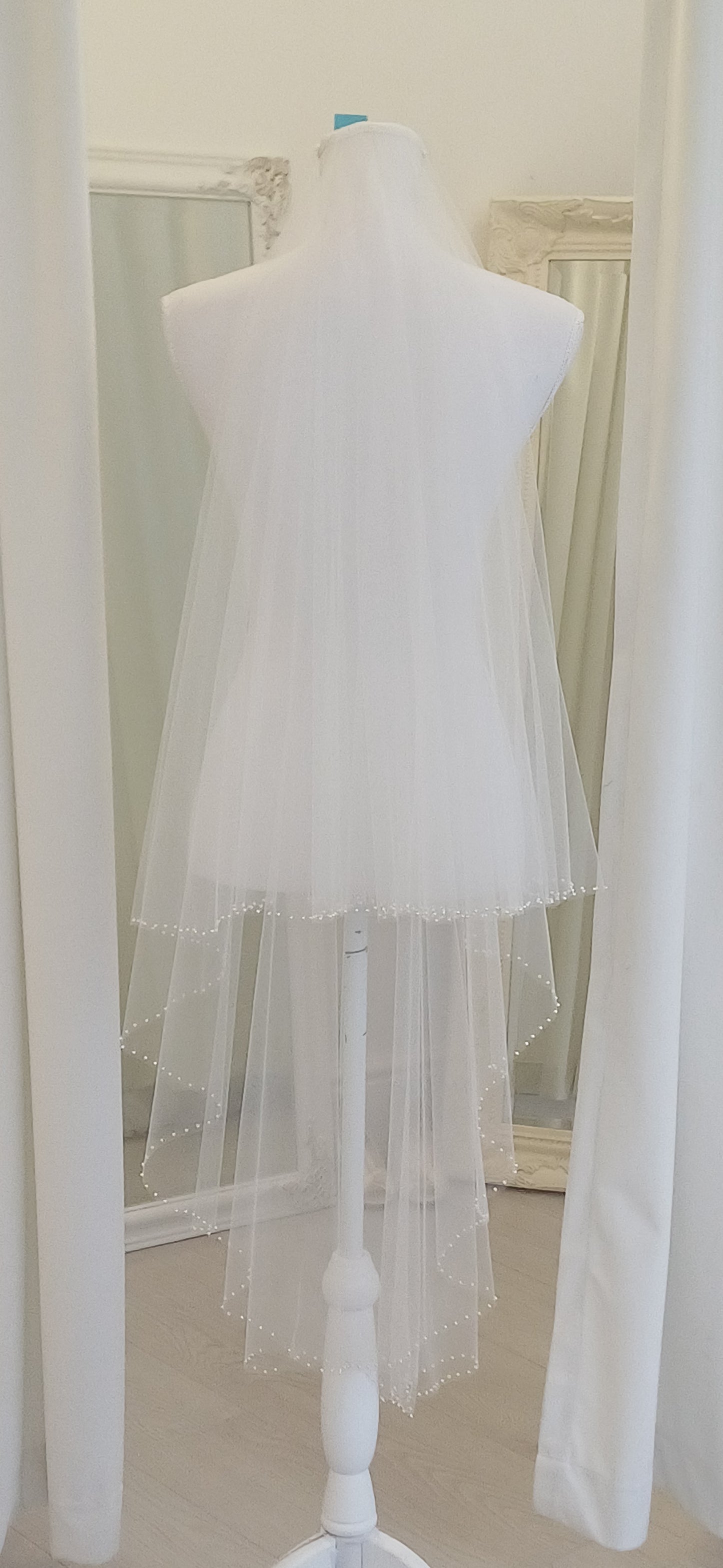 Delicate pearl edged 2 tier fingertip veil