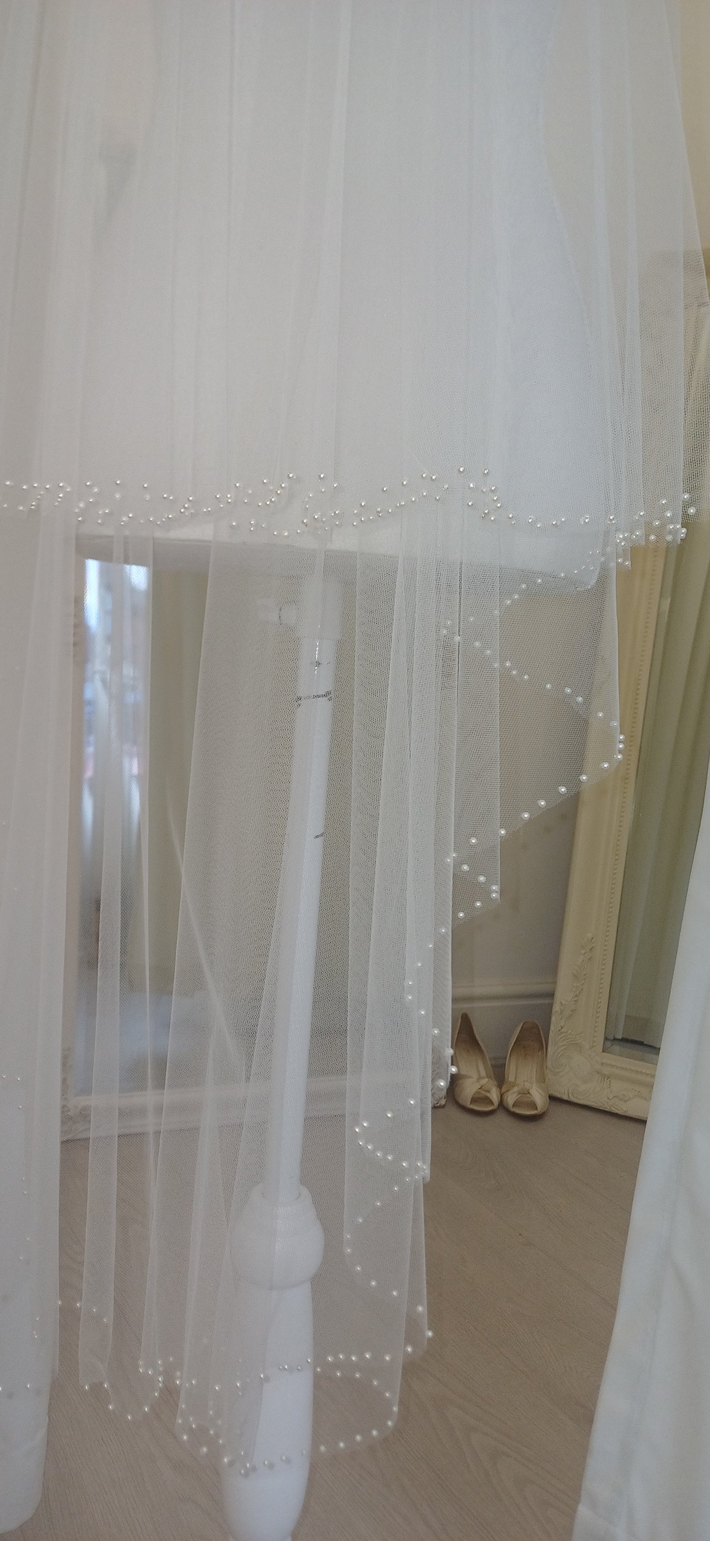 Delicate pearl edged 2 tier fingertip veil