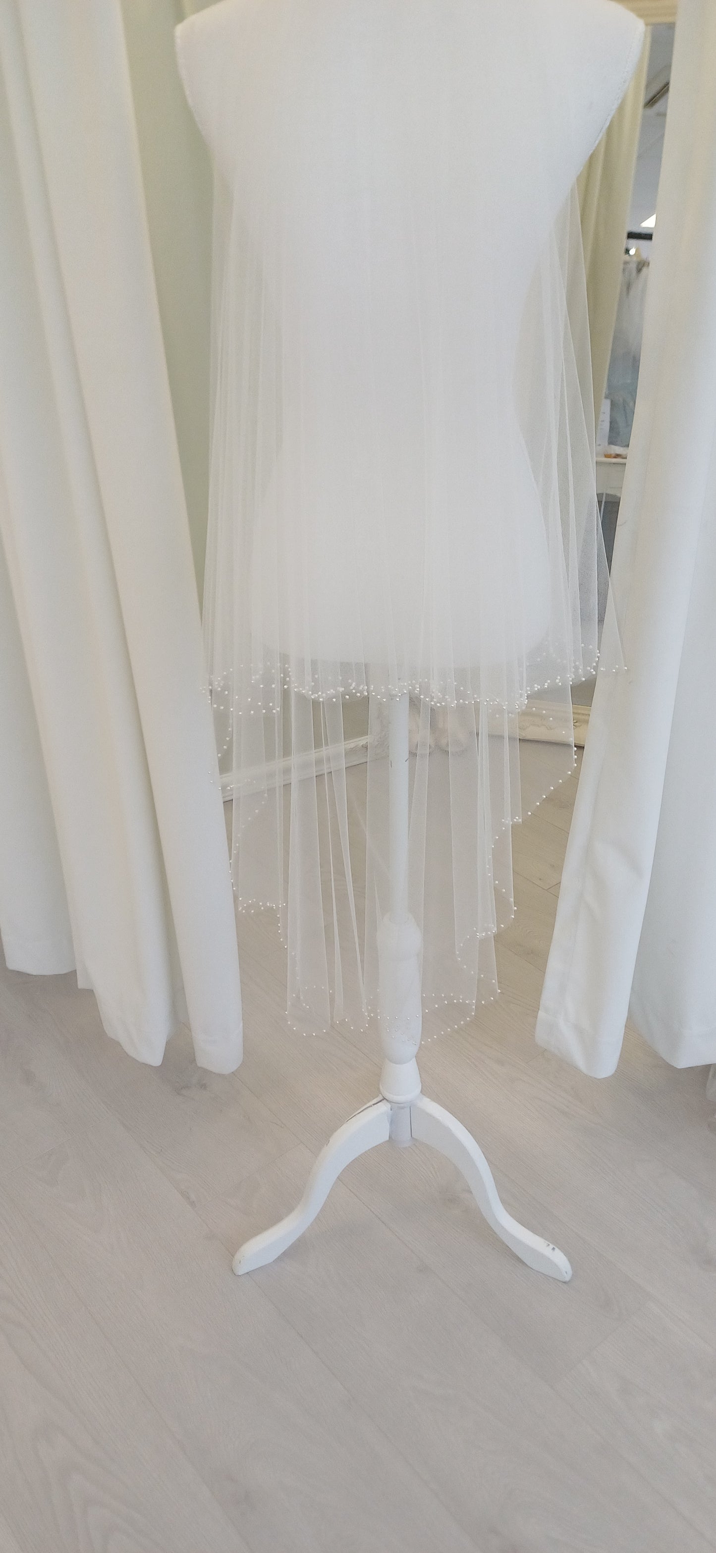 Delicate pearl edged 2 tier fingertip veil