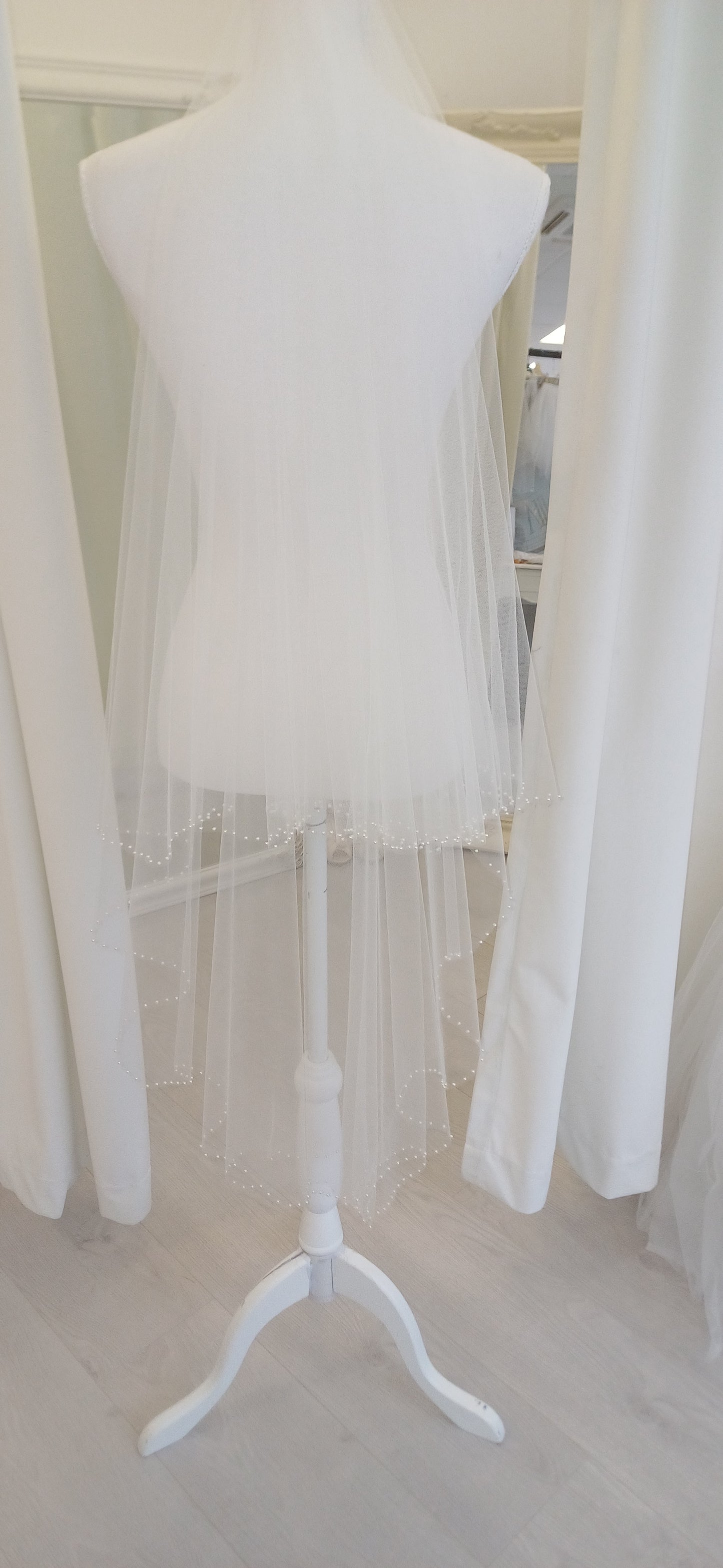 Delicate pearl edged 2 tier fingertip veil